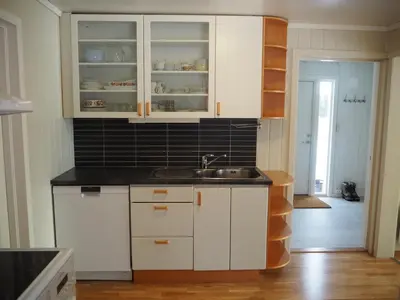 a kitchen with white cabinets and a sink at Cabin with great view close to town and ski area in Lillehammer