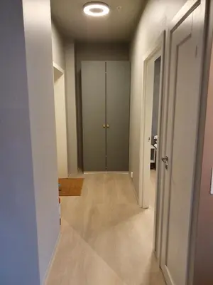an empty hallway with a door in a room at Nygårdsgaten apartments in Bergen