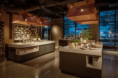 a restaurant with a counter with dishes in it at Scandic Voss in Vossevangen