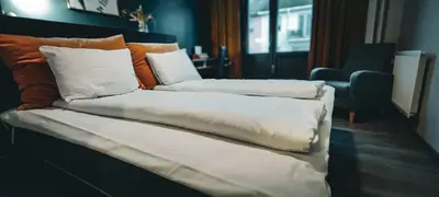two stacks of pillows sitting on top of a couch at Hotell Molde in Molde