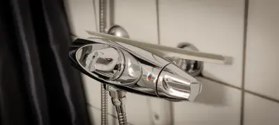 a blow dryer is hanging on a door at Hotell Molde in Molde