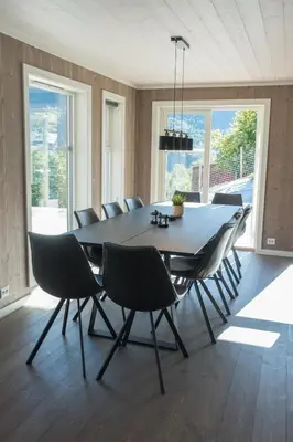 a dining room with a table and chairs at Furetoppen Panorama in Stryn