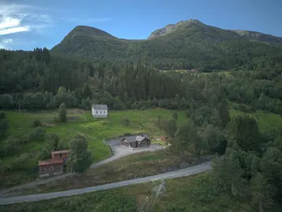 an aerial view of a house in the middle of a mountain at Furetoppen Panorama in Stryn