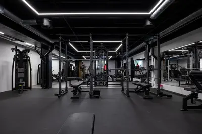 a gym with a lot of equipment in a room at Stryn House Hotel in Stryn