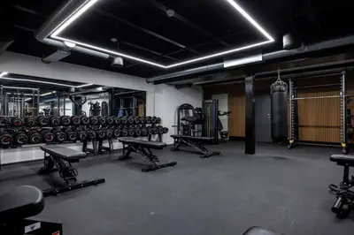 a gym with dumbbells and a lot at Stryn House Hotel in Stryn