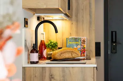 a loaf of bread on a counter with a sink at Stryn House Hotel in Stryn