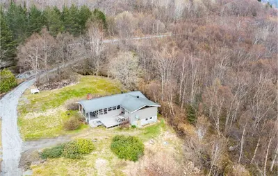 an aerial view of a house in the woods at Awesome Home In Vatne With Wifi in Vatne