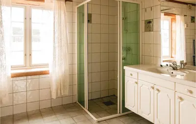 a bathroom with a sink and a shower at Beautiful Home In Tynset With Kitchen in Tynset