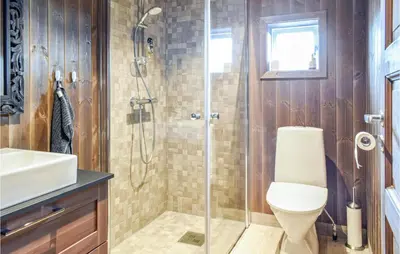 a bathroom with a shower and a toilet and a sink at Gorgeous Home In Sjusjøen With Wifi in Sjusjøen