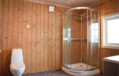 a bathroom with a shower and a toilet in a room at Nice Home In Gol With Kitchen in Gol