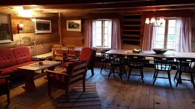 a dining room with a table and chairs at Kvambekk Gard i Åmotsdal in Åmotsdal