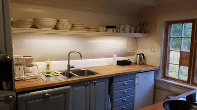 a kitchen with a sink and a counter top at Kvambekk Gard i Åmotsdal in Åmotsdal