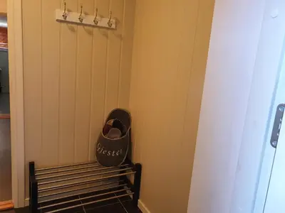 a bench in the corner of a room at Bårdshaug Studio Apartment in Orkanger