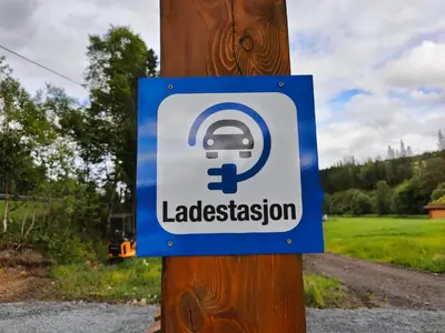 a sign on a pole on a telephone pole at Halland Camping in Berkåk