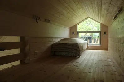 a bedroom with a bed in a room with a window at Lev-Vel - 10 person cabin in Ål