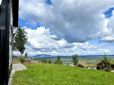 a view of a hill with a green field at Torshaug 4 bedroom cabin in Gol
