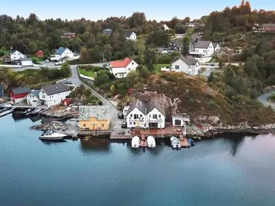 an aerial view of a house on an island in the water at Seaside Fisherman s Haven-By Traum in Steinsbø