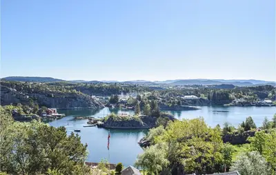 arial view of a river with trees and houses at 2 Bedroom Cozy Home In Hauglandshella in Kolavåg