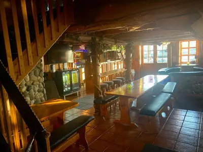 an overhead view of a restaurant with a table and chairs at Frimannsbuda in Selje
