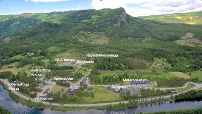 an aerial view of a mountain with a town and a river at Torpomoen in Torpo