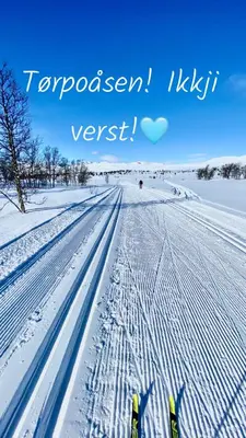 a snow covered road with a heart in the sky at Torpomoen in Torpo