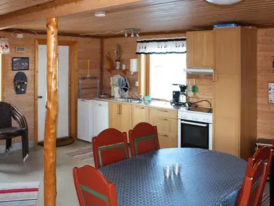 a kitchen with a table and chairs in a room at 6 person holiday home in Brekstad in Brekstad