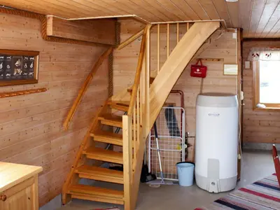 a ladder leading up to a loft in a tiny house at 6 person holiday home in Brekstad in Brekstad