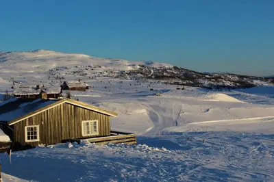 a small cabin in the snow on a mountain at Kjøniksbu - 3 bedroom cabin in Ål