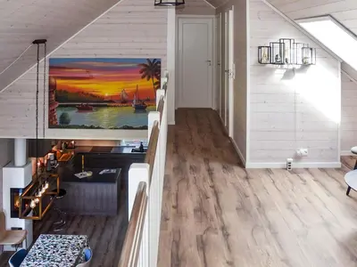 a living room with a painting on the wall at 8 person holiday home in Åram in Sandvik