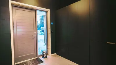 a hallway with a door and a window at Topcamp Hallingdal - Ål in Ål