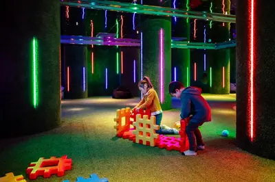 a boy and a girl playing with a toy castle at Hotel Alexandra Loen in Loen