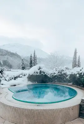 a hot tub with snow on top of it at Hotel Alexandra Loen in Loen