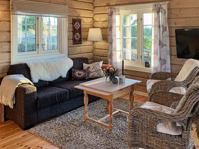 a living room with a couch and a table at 6 person holiday home in Svingvoll in Svingvoll
