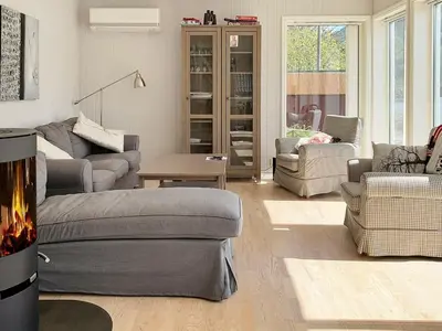 a living room with a couch and chairs at 6 person holiday home in ETNE in Etnesjøen