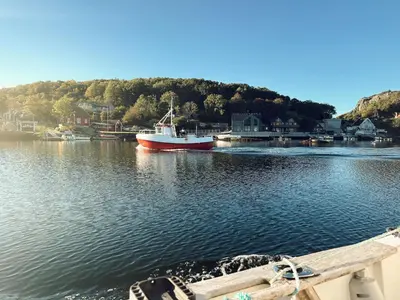 a boat is docked in a body of water at Holiday Home Brosme by Interhome in Bømlo