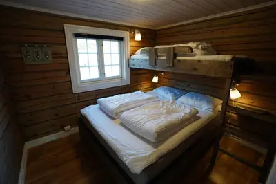 a bedroom with two bunk beds in a cabin at Lake View Apartment 2 bedrooms and loft in Stranda