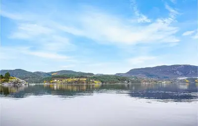 a view of a lake with mountains in the background at Solvang in Hebnes