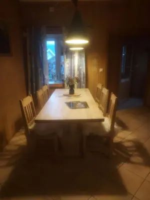 a dining room table and chairs in a room with a window at Valdres Naturlegvis in Fagernes