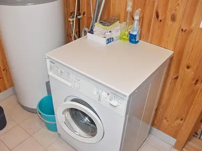 a washer and dryer with a box on top of it at Seaside Serenity in Settem Fjord-By Traum in Bø
