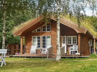 a small log cabin with a grass roof at Seaside Serenity in Settem Fjord-By Traum in Bø
