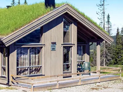 a small house with a grass roof at 10 person holiday home in Fåvang in Favang