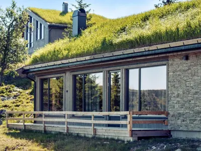 an image of a house with a grass roof at 10 person holiday home in Fåvang in Favang