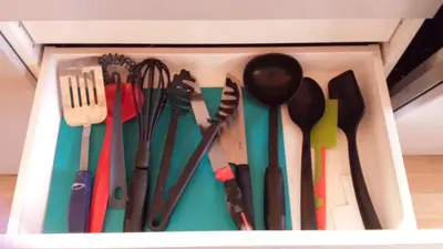 a drawer filled with lots of utensils at Trollveggen Camping in Åndalsnes