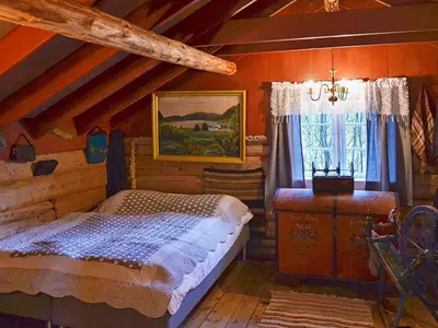 a bedroom with a bed and a window at Vintage Charm by the Sea-By Traum in Bø