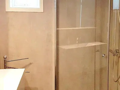 a bathroom with a shower and a sink at 10 person holiday home in Brattvåg in Brattvåg