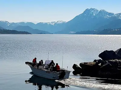 a group of people on a boat in the water at 10 person holiday home in Brattvåg in Brattvåg