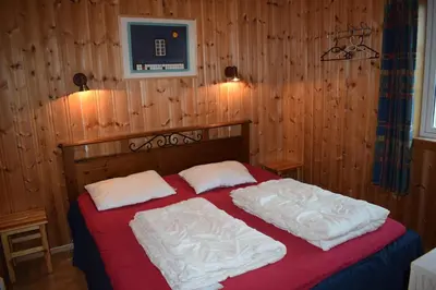 a bedroom with a bed with two white pillows at Skeikampen Booking in Svingvoll