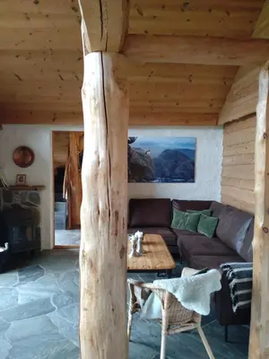 a living room with a couch and a table at Troll Fjordhytter in Syvde