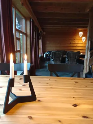 a table with two candles on top of it at Troll Fjordhytter in Syvde