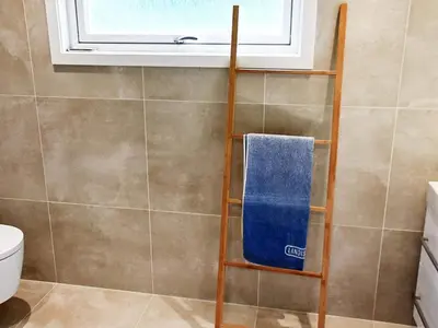 a towel rack in a bathroom with a window at 10 person holiday home in MIDSUND in Midsund